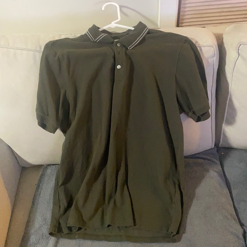 Green polo with white stripes at collar